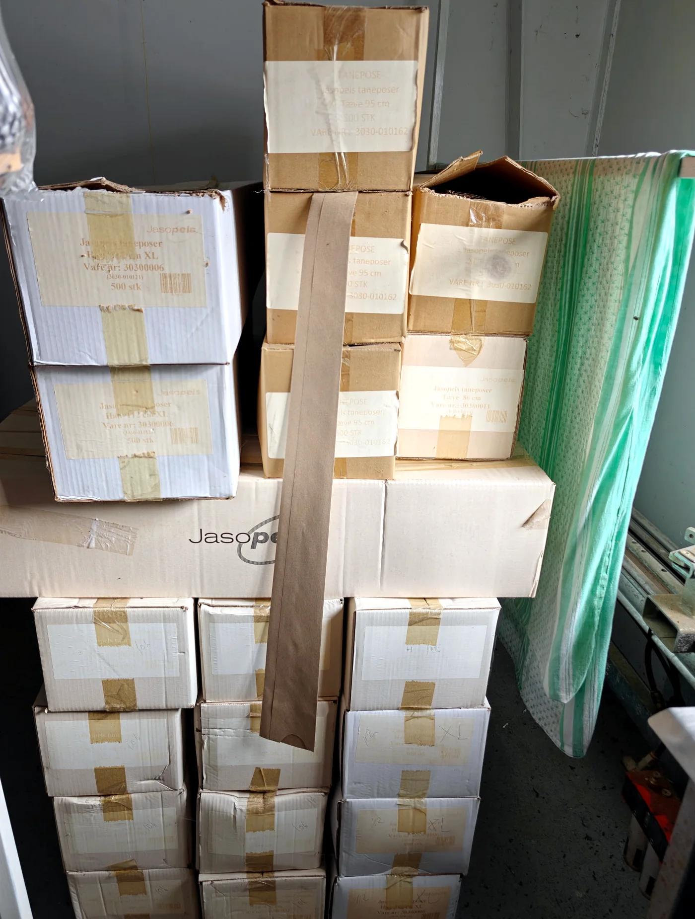 Boxes and packed Jasopels wrapping film rolls in storage